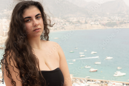 Young woman enjoying travel destination in calpe, spain