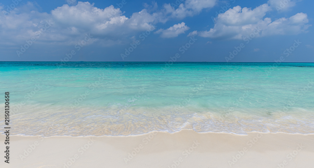 Fototapeta premium Vibrant turquoise sea calm ocean waves blue sunny sky fluffy clouds tropical summer horizon. Peaceful minimal seascape nature landscape. Bright paradise wellbeing backdrop scenic panoramic wallpaper