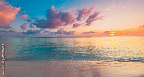 Dreamy panoramic pastel sunset calm sea soft pink clouds tropical beach shore evening glow. Peaceful summer seascape nature landscape. Meditation wellbeing wallpaper romantic coastal banner