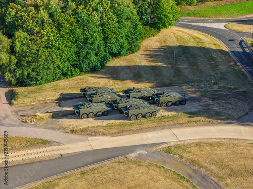Military Armored Vehicles Parked at a Vehicle Testing Facility on a Sunny Day