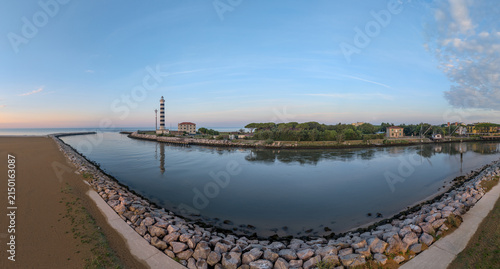 Panoramic Coastal Lighthouse at Calm Harbor During Blue Hour
