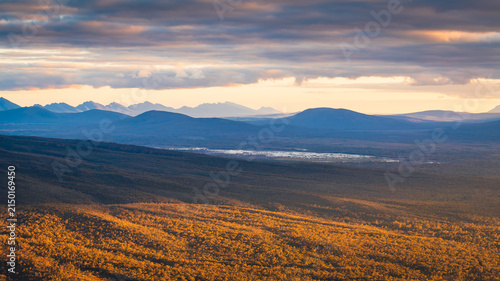 Mountain vista landscape in Grampians National Park, Victoria, Australia, during a bright, dramatic sunset with stormy clouds.