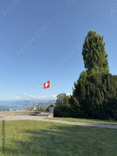 Flagpole and Terrace Viewpoint Above a Swiss Lake