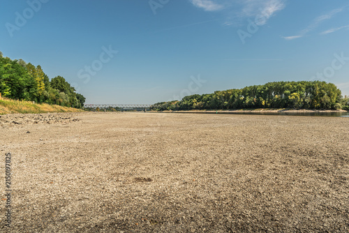 Low water level and vast dry riverbed of the Rhine River during summer drought, Germersheim, Germany