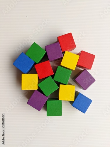 wooden toy blocks. A group of colourful cube blocks isolated on white background