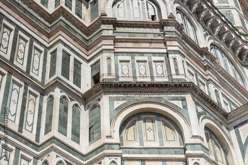 The architectural details of the cathedral of santa maria del fiore on a sunny day in Florence italy