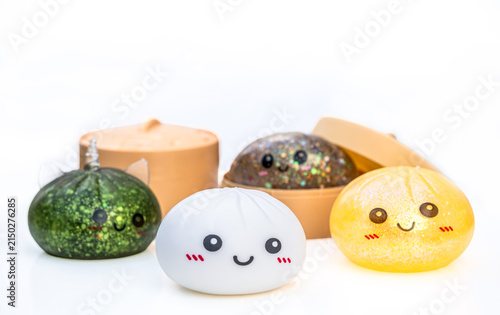 Colorful Dumpling Toy Collection with Sparkling, Glitter and Transparent Squishy Toys on white background isolated with copy space
