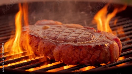 Juicy Steak Grilling on Open Flame in Outdoor Barbecue Setting