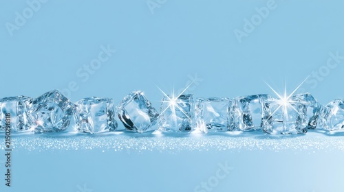 Row of sparkling ice cubes arranged on a light blue surface