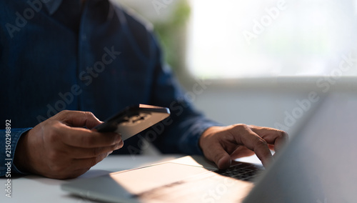 Businessman typing and using laptop computer communicates on internet technology on office desk. Workplace, Businessman professional working on new job project. Business technology concept.