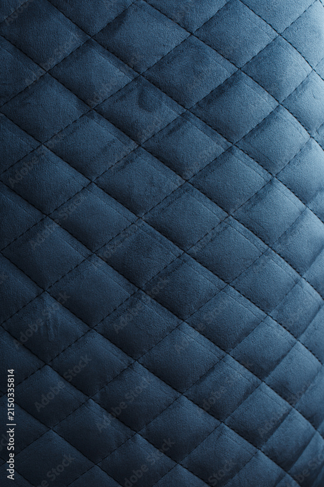 Obraz premium Close-Up of Dark Blue Quilted Velvet Fabric with Elegant Diamond Upholstery Pattern