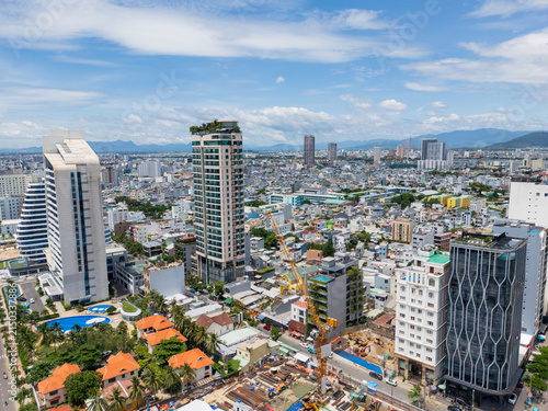 Overview of a congested city skyline with construction underway