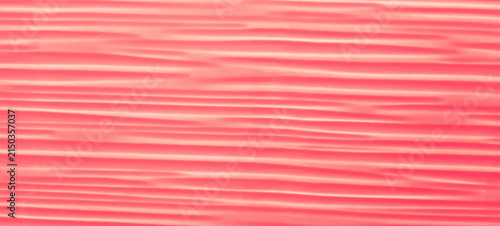Konstfotografi An abstract scarlet background with curved, smooth, frequent lines across the en