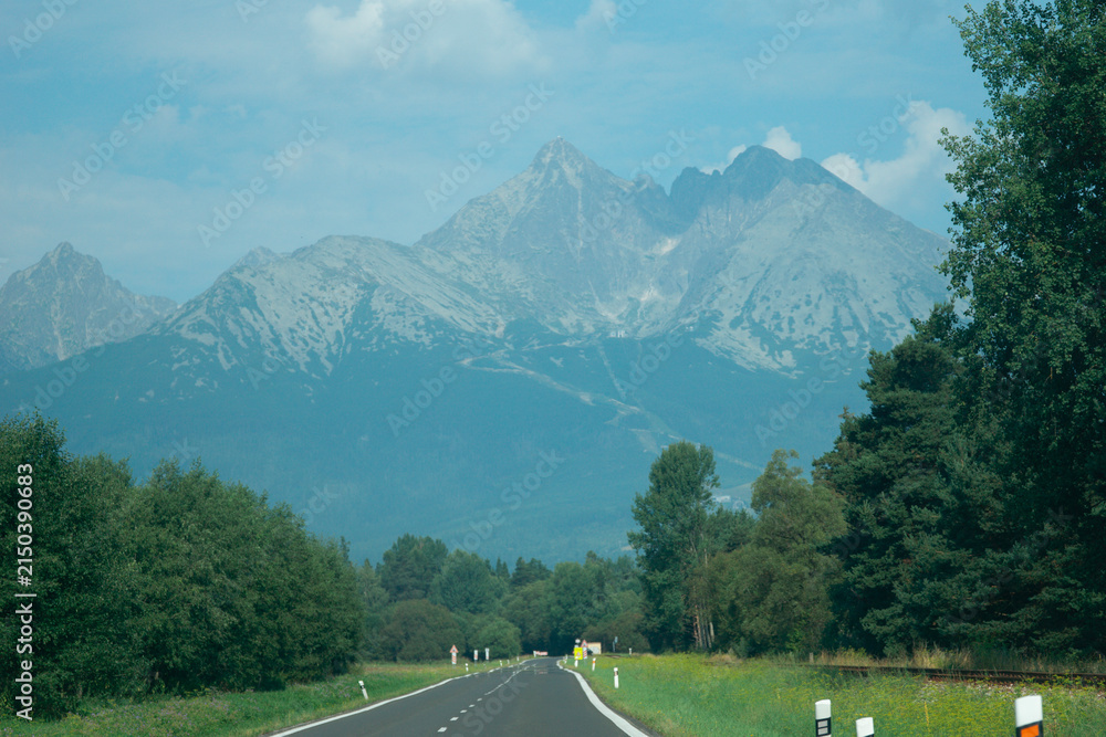 Fototapeta premium lomnicky stit mountain peak in slovakia high tatras landscape view green forest nature rocky summit concept of travel, tourism, nature