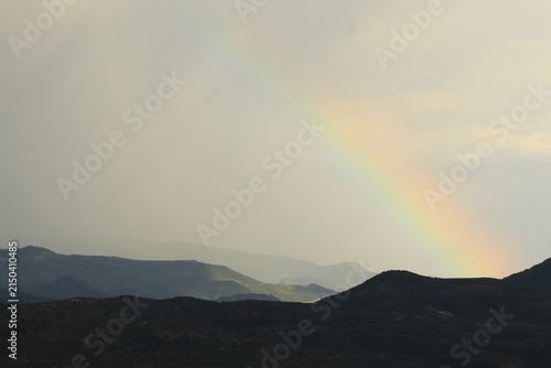 Hope and natural beauty, rainbow over Berat Castle mountains in Albania, scenic landscape after rain