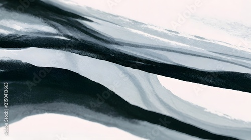 Abstract black and white brushstroke pattern with flowing lines creating dynamic contrast and textured depth
