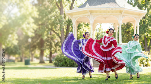 Hispanic Heritage Month celebration featuring Latina women performing traditional folk dance in vibrant colorful dresses at a sunlit park gazebo, expressing joyful cultural heritage, tradition and pri