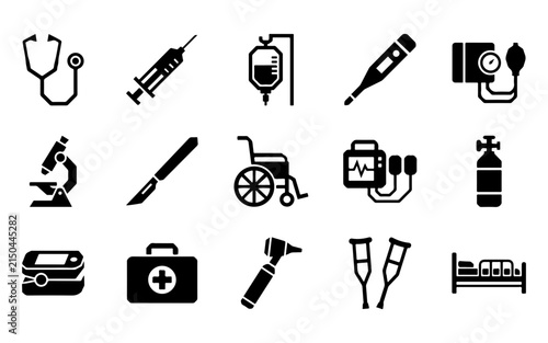 A comprehensive set of black flat icons representing essential medical equipment used in hospitals and clinics for patient care