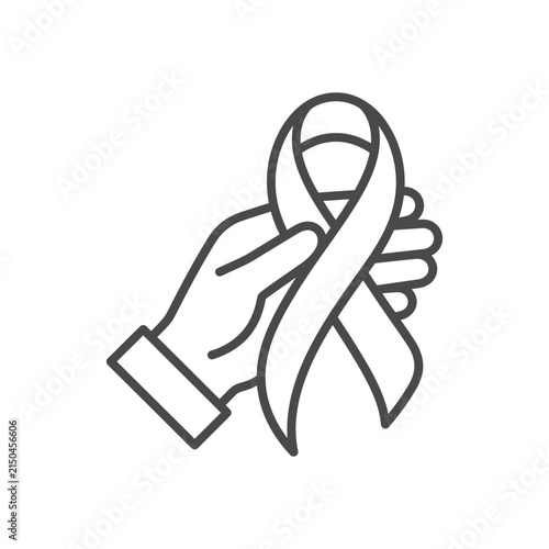 Hand holding awareness ribbon for support.
