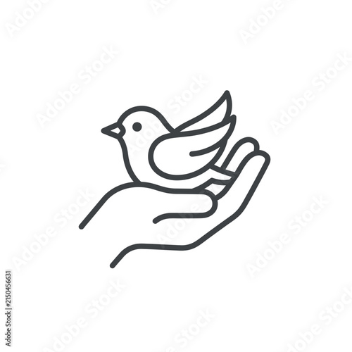 Hand holding bird peace symbol.