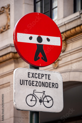 Obraz na plátně Creative no entry street sign with bicycle exception in urban setting