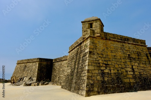 The grand silhouette of Forte de São João Baptista framing the Atlantic