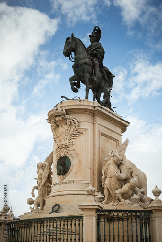 Equestrian statue at Praça do Comércio in Lisbon standing beneath a bright blue sky, showcasing one of Portugal’s most famous historic city landmarks.