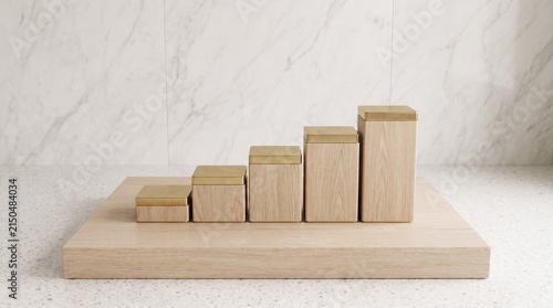Wooden blocks arranged as a rising growth chart on a marble surface for business concept.