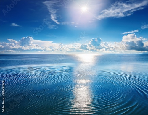 serene ocean landscape sunlit water with concentric ripples reflecting heavenly azure sky