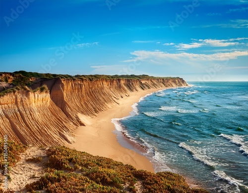 pixelated sandy cliff by ocean