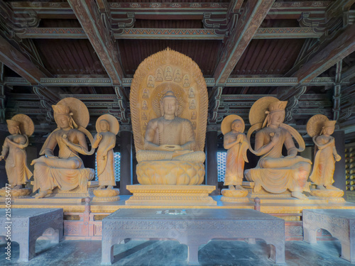 Картината върху платно Buddhist statues in ancient temple hall at Dantong China