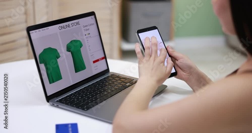 Woman using smartphone for shopping online at white table indoors, closeup