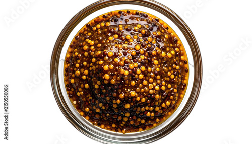 A close-up view of whole grain mustard in a clear glass jar. isolated on white background