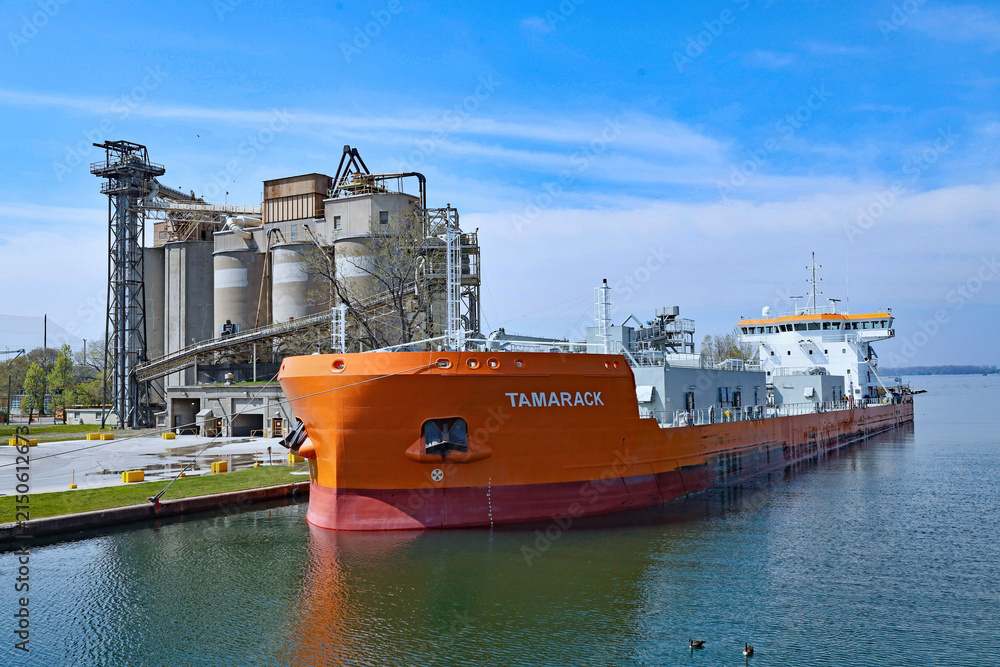 Fototapeta premium lake freighter in Toronto harbor beside a cement plant