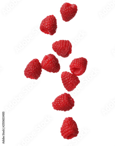 Fresh red raspberries falling isolated on white background for food photography design.