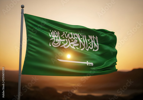 Saudi arabia flag waving at sunset with the sun behind it
