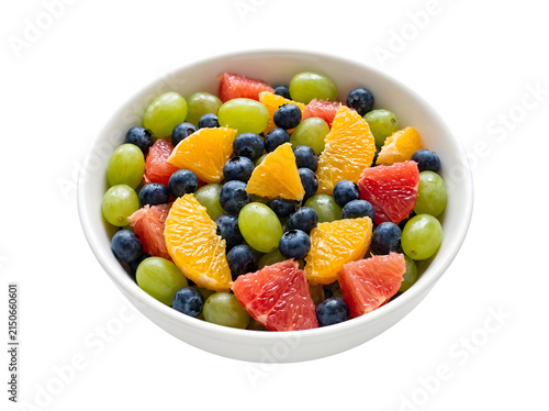 Fresh fruit salad with grapes blueberries and citrus in a white bowl isolated on transparent background