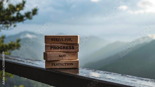Progress over perfection concept with wooden blocks showing continuous improvement in nature