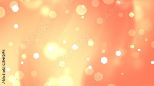 Background animation featuring soft golden light circles and bright blurred glowing bokeh.