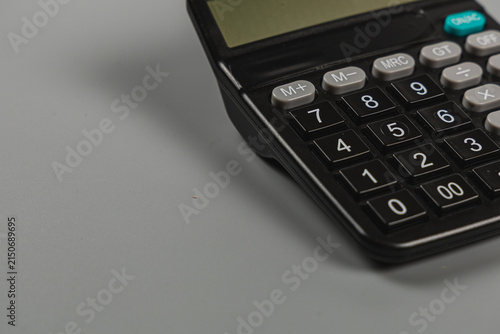 Using a calculator for finance and budgeting tasks in an office