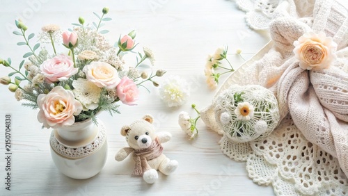 Pastel Flowers, Knitted Wrap, and a Plush Teddy Bear Arrangement on a White Wooden Surface