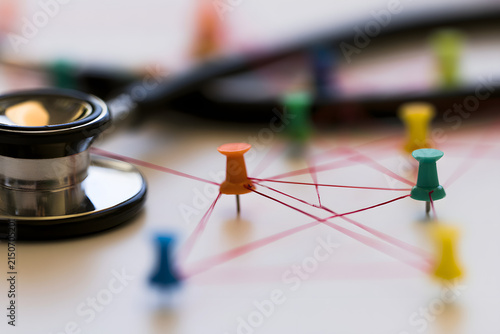 Stethoscope Linked to Eye-catching Pins, Highlight the complex network of referrals and consultations among general practitioners and specialists