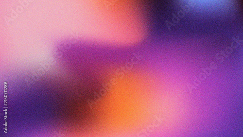 Abstract blurred background with grainy texture in vibrant purple, orange, and pink gradient colors