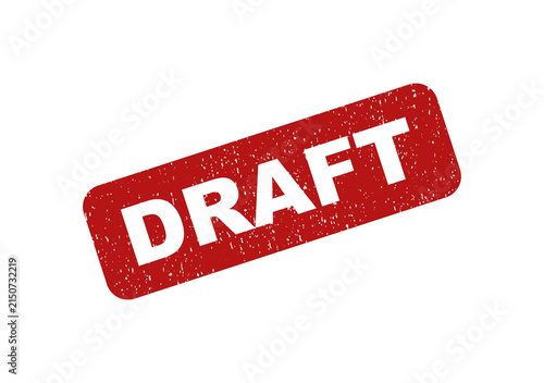 Red rubber stamp with the word draft on a tilted rectangular frame