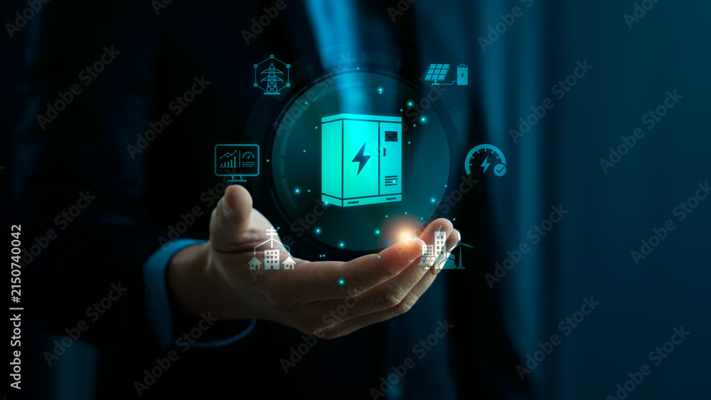 Fototapeta premium Smart grid and battery storage concept with business hand holding digital power cabinet interface showing renewable energy infrastructure solar electricity management and sustainable technology