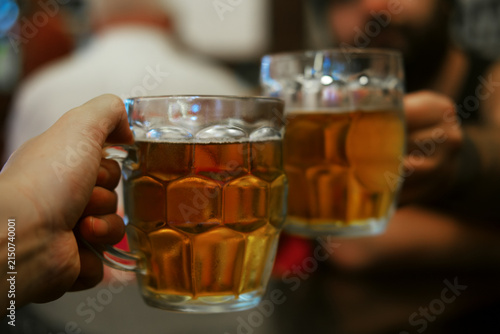 Konstfotografi Male hands with beer glasses