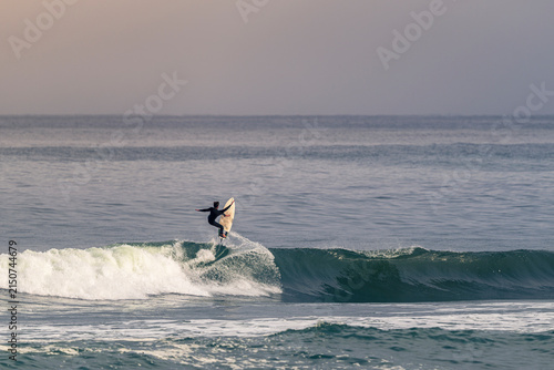 Canvas Print Surfer Catching Air on Ocean Wave Action Shot