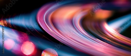 Abstract swirling light trails in neon pink and blue colors
