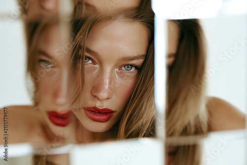Abstract Reflection Portrait of Woman with Mirror Fragments and Bold Red Lips