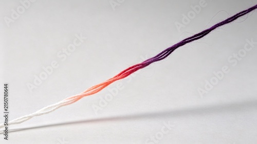 Gradient thread transitioning from white to purple